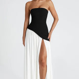 Vestido longo em jersey com decote redondo e fenda lateral para um look fluido e elegante, ideal para ocasiões especiais…